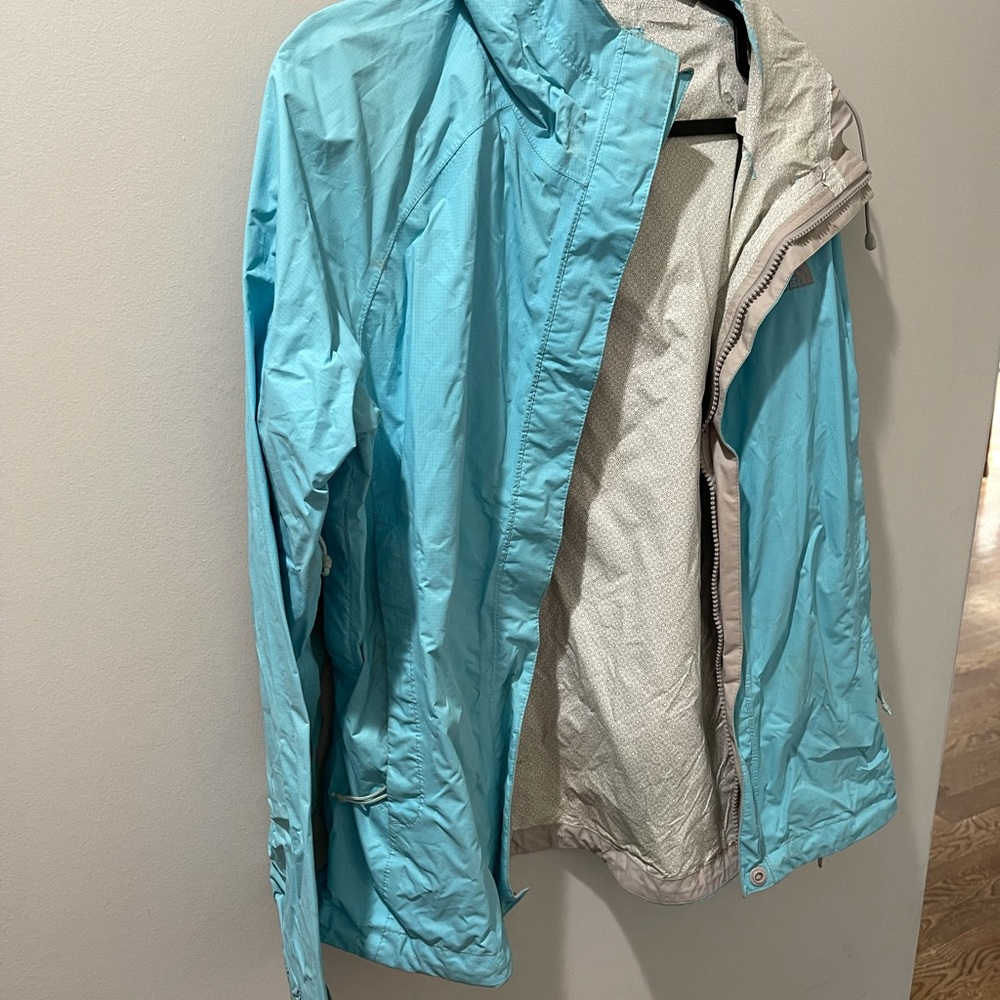 Women’s blue North Face rain jacket.